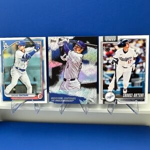 Three Shohei Ohtani cards (Two 2026 Topps cards)